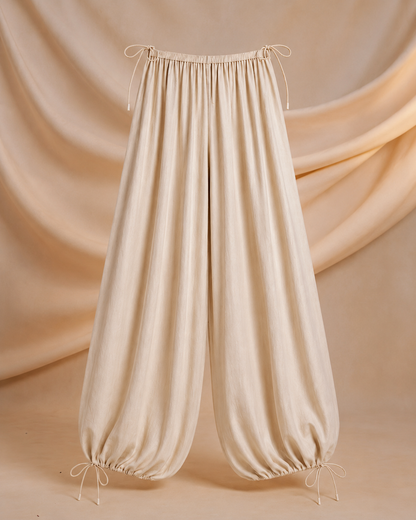 Side profile showing the high waist and wide leg drape